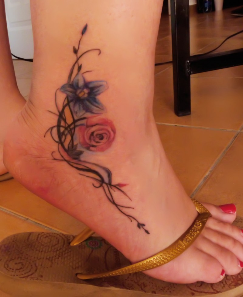 Tribal and color flowers ankle tattoo for girls - Tattooimages.biz